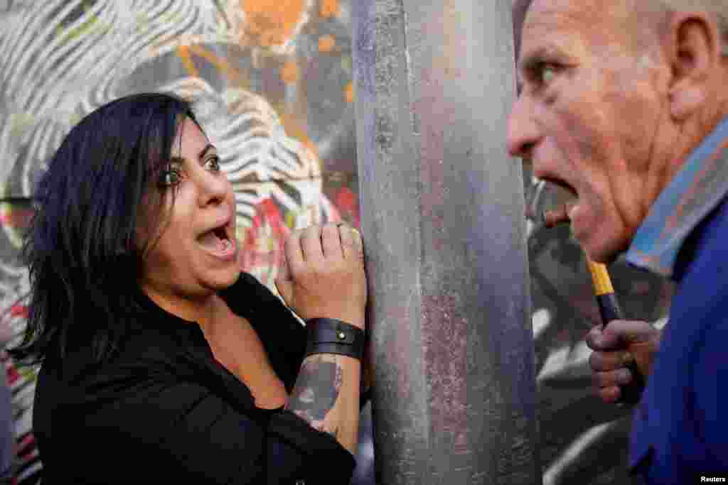 Protesters shout during ongoing anti-government protests in Beirut, Lebanon.