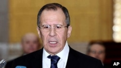 In this photo released by the Syrian official news agency SANA, Russian Foreign Minister Sergey Lavrov, speaks to reporters after his meeting with Syrian President Bashar Assad, at the presidential palace, in Damascus, February 7, 2012.