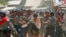 Police hit a student protester in Letpadan. Myanmar police beat students with batons and detained some of them as they broke up a group of about 200 protesters who had been locked in a standoff with security forces for more than a week, a Reuters witness said. The students were protesting an education bill they say stifles academic independence.
