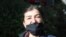 FILE - In this May 24, 2020, photo, Muyesser Yildiz wears a face mask to protect against the coronavirus as she visits a public garden, in Ankara, Turkey.