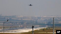 FILE - A Turkish Air Force jet is seen taking off from Incirlik Air Base, near Adana, southeastern Turkey, July 28, 2015. Turkish warplanes have stepped up attacks on Kurdish YPG rebels in Syria, the Turkish military announced Thursday.