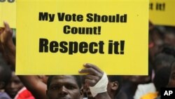 A Zimbabwe human rights activist marches in Harare on World Human Rights Day, Friday, December, 10, 2010. (AP Photo/Tsvangirayi Mukwazhi)