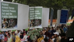 Placards hang at a site of protest rally organized by members of civil society and political parties to convey their solidarity to the people of Jammu & Kashmir in New Delhi, India, Oct. 29, 2019. 