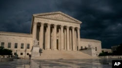 FILE - In this June 20, 2019 file photo, The Supreme Court is seen under stormy skies in Washington. The Supreme Court says it will hear President Donald Trump's pleas to keep his tax, bank and financial records private. 