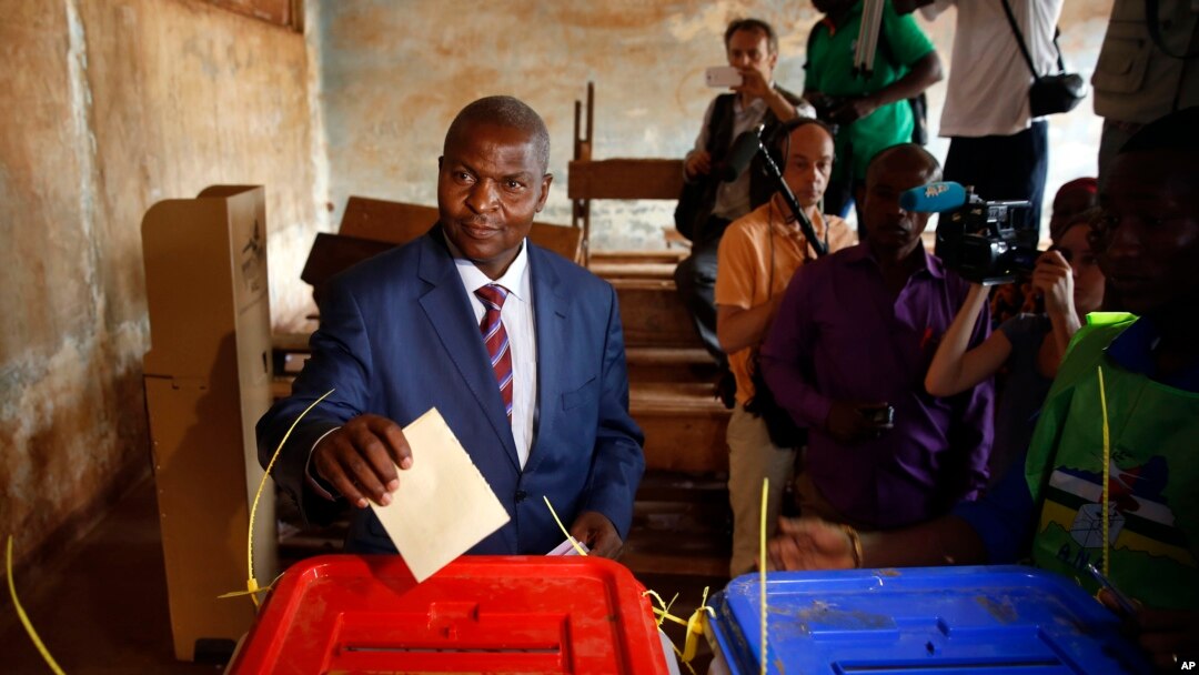 FILE - Former Prime Minister Faustin Archange Touadera casts his ballot in the second round of presidential election and the first round of legislative elections in Bangui, Central African Republic, Feb. 14, 2016. Touadera was declared winner of the election Feb. 20.