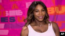 Professional tennis player Serena Williams appears at an event to launch a national street art campaign with Allstate Foundation Purple Purse to make domestic violence and financial abuse visible, at TicTail Market on June 20, 2018, in New York.