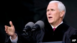 FILE - Vice President Michael Pence speaks at the commencement ceremony at Grove City College, May 20, 2017, in Grove City, Pennsylvania. On Saturday, Pence spoke at the University of Notre Dame in Indiana, where dozens of students staged a walk-out during his address.