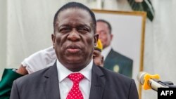 Zimbabwe's new President Emmerson Mnangagwa presides over a swearing in ceremony as his new cabinet took office on Dec. 4, 2017 at State House in Harare.