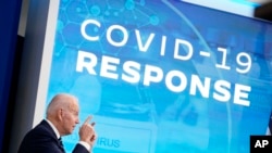 President Joe Biden speaks about the government's COVID-19 response, in the South Court Auditorium in the Eisenhower Executive Office Building on the White House Campus in Washington, Jan. 13, 2022.