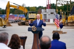 FILE - President Joe Biden delivers remarks on his Build Back Better agenda during a visit to the International Union of Operating Engineers Local 324, in Howell, Mich., Oct. 5, 2021.