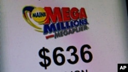 A sign advertises the value of the Mega Millions lottery at a convenience store in Lisbon, Maine, Dec. 17, 2013.