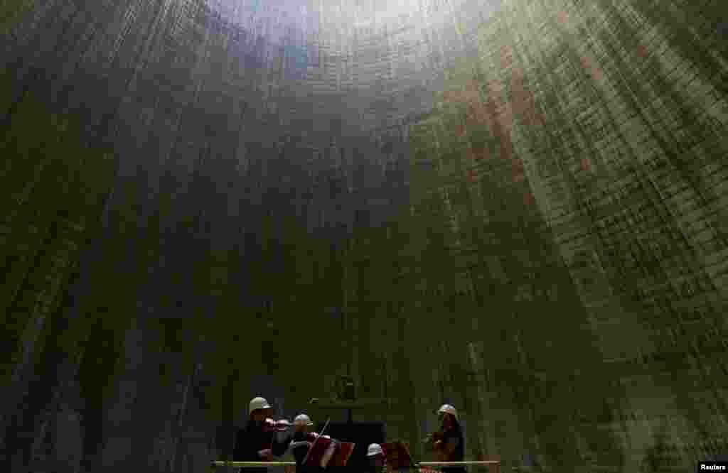 The South Bohemian Philharmonic Quartet performs inside a cooling tower at the Temelin nuclear power plant near the town of Tyn nad Vltavou, Czech Republic, June 20, 2016.