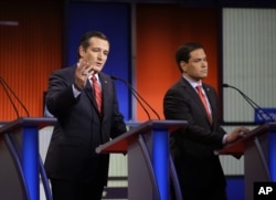 FILE - Ted Cruz speaks as Marco Rubio listen during a Republican presidential primary debate.