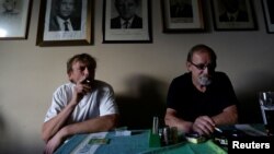 FILE - Men smoke cigarettes in a bar on a last day before a smoking ban comes into effect in Prague, Czech Republic, May 2017. (REUTERS/David W Cerny)