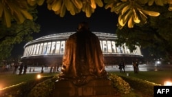 View of the Indian Parliament illuminated prior to a special session for the implementation of the new Goods and Services Tax (GST) regime in New Delhi, June 30, 2017. 