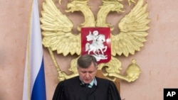 Russia's Supreme Court judge Yuri Ivanenko reads the decision in a court room in Moscow, Russia, April 20, 2017. Russia's Supreme Court banned the Jehovah's Witnesses from operating in the country.