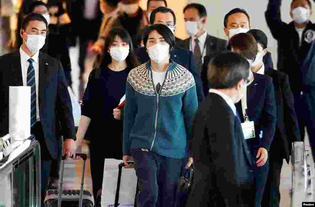 Mako Komuro, former Japan&#39;s Princess Mako and the eldest daughter of Crown Prince Akishino and Crown Princess Kiko, and her newly married husband Kei board a flight bound for New York to start their new life in the U.S. at Haneda airport in Tokyo, Japan.