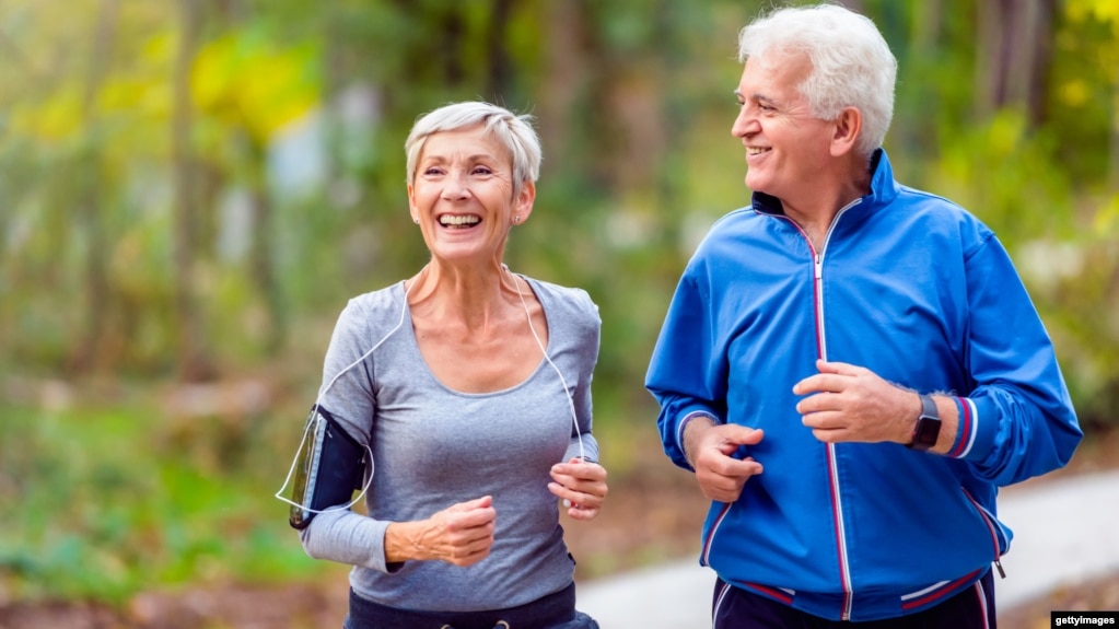 An older couple couple jogging in the park. (Getty Images)