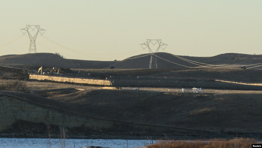 Dakota Access Pipeline equipment is seen near Lake Oahe, near the Standing Rock Indian Reservation, in this picture taken from across the Missouri River in Linton, North Dakota, Nov. 9, 2016.