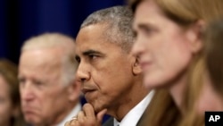 President Barack Obama (C) joined by Vice President Joe Biden (L) and United States United Nations Ambassador Samantha Power (R) looks to Iraqi Prime Minister Haider al-Abadi as he speaks to media during a bilateral meeting at the Lotte New York Palace Hotel in New York, N.Y., Sept. 19, 2016.