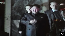 In this December 27, 2011 screen capture from North Korean TV, Kim Jong-Un, son of late N. Korean leader Kim Jong-Il wipes tears as he receives people at the Kumsusan Memorial Palace in Pyongyang on December 26, 2011.