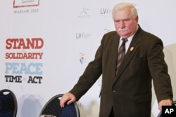 FILE - Former Polish president Lech Walesa after a news conference in Warsaw, Poland.