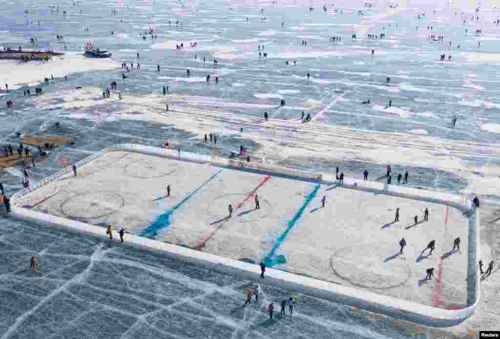 An aerial view shows a hockey rink after a match on the ice of Lake Baikal, organized to draw attention to the environmental problems of the lake, in the village of Bolshoye Goloustnoye in Irkutsk region, Russia.