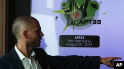 Alister Shepherd, the director of a subsidiary of the cybersecurity firm FireEye, gestures during a presentation about the APT33 hacking group, which his firm suspects are Iranian government-aligned hackers, in Dubai, United Arab Emirates, Sept. 18, 2018.