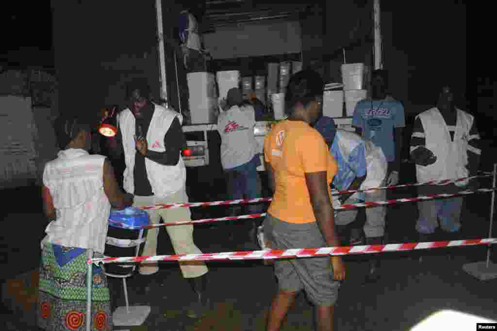 People moving through the line to receive home disinfectant kits from Doctors Without Borders to prevent Ebola in Monrovia, Liberia, Oct. 20, 2014.