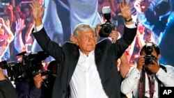 Presidential candidate Andres Manuel Lopez Obrador, of the MORENA party, waves to supporters as he arrives for his closing campaign rally at Azteca stadium in Mexico City, June 27, 2018. 