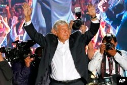 FILE - Presidential candidate Andres Manuel Lopez Obrador, of the MORENA party, waves to supporters as he arrives for his closing campaign rally at Azteca stadium in Mexico City, June 27, 2018.