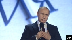 Presiden Rusia Vladimir Putin membuka pertemuan Masyarakat Geografi Rusia di Moskow (9/12). 