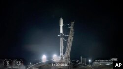 A SpaceX rocket launches from Vandenberg Space Force Base early Saturday, Dec. 18, 2021 at Vandenberg Space Force Base in California. 