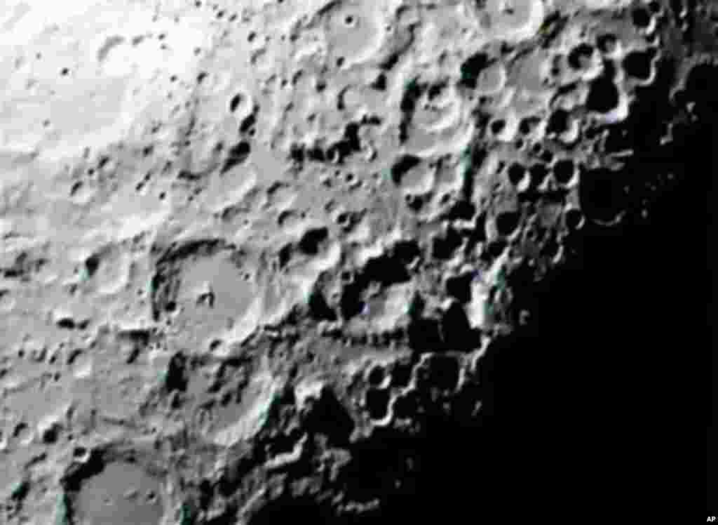 This 2009 image provided by NASA shows the area of the lunar South Pole where the LCROSS experiment, Lunar Crater Observation and Sensing Satellite, hurtled a spent Centaur rocket into a dark crater and then measured the resulting plume of dust, debris an