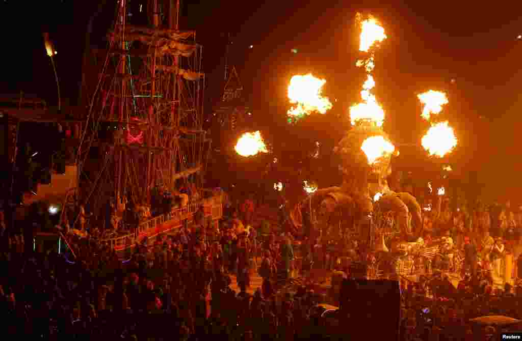 A mutant vehicle shoots flames as approximately 70,000 people from all over the world gather for the 30th annual Burning Man arts and music festival in the Black Rock Desert of Nevada, USA, Sept. 3, 2016.