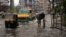 Vehicles move through a waterlogged street during heavy rainfall in Kochi, Kerala state, India, Aug. 7, 2020.