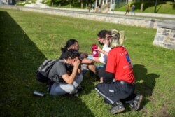 Medics help protesters after Montreal Police used tear gas during a march against police brutality and racism in Montreal on June 7, 2020.