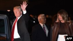 U.S. President Donald Trump and first lady Melania Trump disembark from Air Force One upon arrival at Ezeiza International Airport in Buenos Aires, Argentina, Nov. 29, 2018, as they travel to attend the G20 summit.