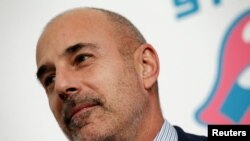 NBC Today Show host Matt Lauer poses for photographers as he arrives for the opening of an exhibit in New York, Nov. 15, 2016. 