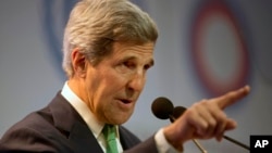 FILE - United States Secretary of State John Kerry delivers a speech at the U.N. Climate Change Conference in Lima, Peru.