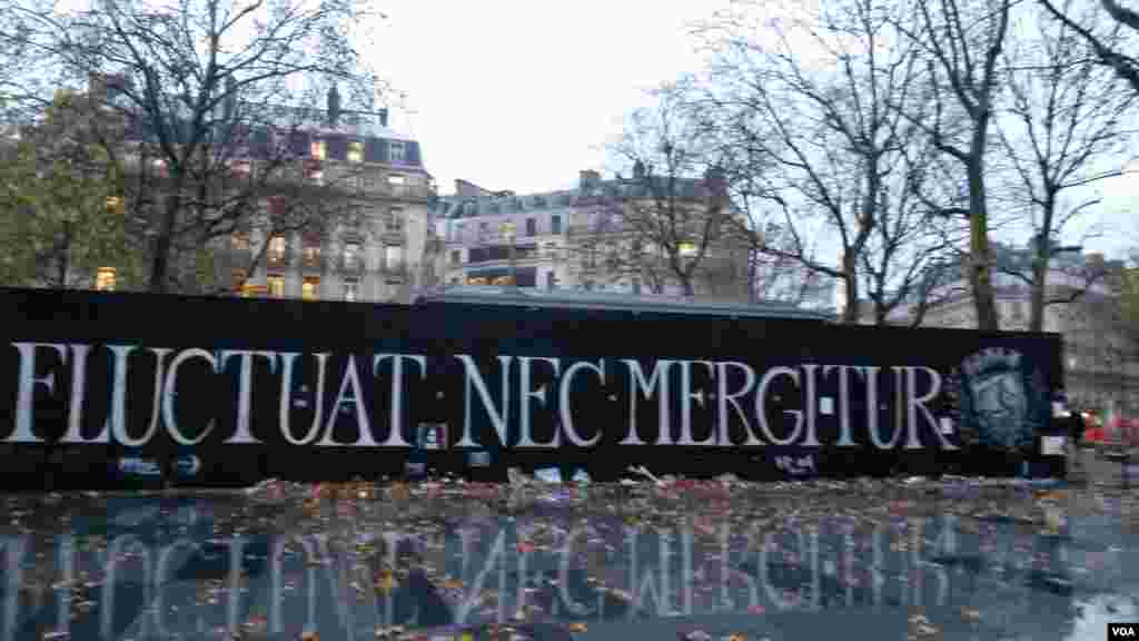 Fluctuat Nec Mergitur at République. (E. Bryant/VOA)