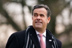 FILE - Director of National Intelligence John Ratcliffe waits on the South Lawn of the White House in Washington, Dec. 12, 2020.