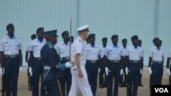 U.S. Navy Admiral James Foggo, in Ghana to participate in a conference on international maritime defense, inspects Navy personnel. (Stacey Knott for VOA)