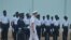 U.S. Navy Admiral James Foggo, in Ghana to participate in a conference on international maritime defense, inspects Navy personnel. (Stacey Knott for VOA)