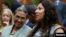 Socorro Hernandez (left) and Tania D' Amelio talk during their swearing in ceremony as new board members of the National Electoral Council, at the Supreme Court in Caracas, Venezuela, Dec. 14, 2016. 