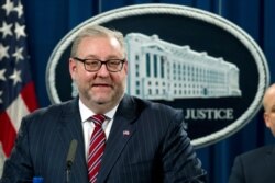 FILE - Assistant Attorney General Brian Benczkowski speaks during a news conference at the Justice Department in Washington, Nov. 28, 2018.