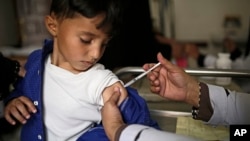 FILE - A boy receives a diphtheria vaccine at a hospital in Sanaa, Yemen, Sept. 9, 2019.