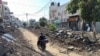 Palestinians ride a motorcycle on a damaged street following an Israeli military operation in Jenin in the Israeli-occupied West Bank Sept. 6, 2024.