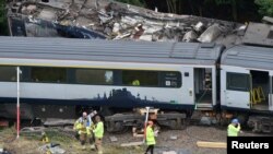 Emergency services inspect the site of the derailment of the ScotRail train, near Stonehaven, Aberdeenshire, Scotland, Britain, Aug. 13, 2020. 