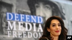 FILE - International human rights lawyer Amal Clooney attends a Foreign Ministers G7 meeting in Dinard, Brittany, April 5, 2019.